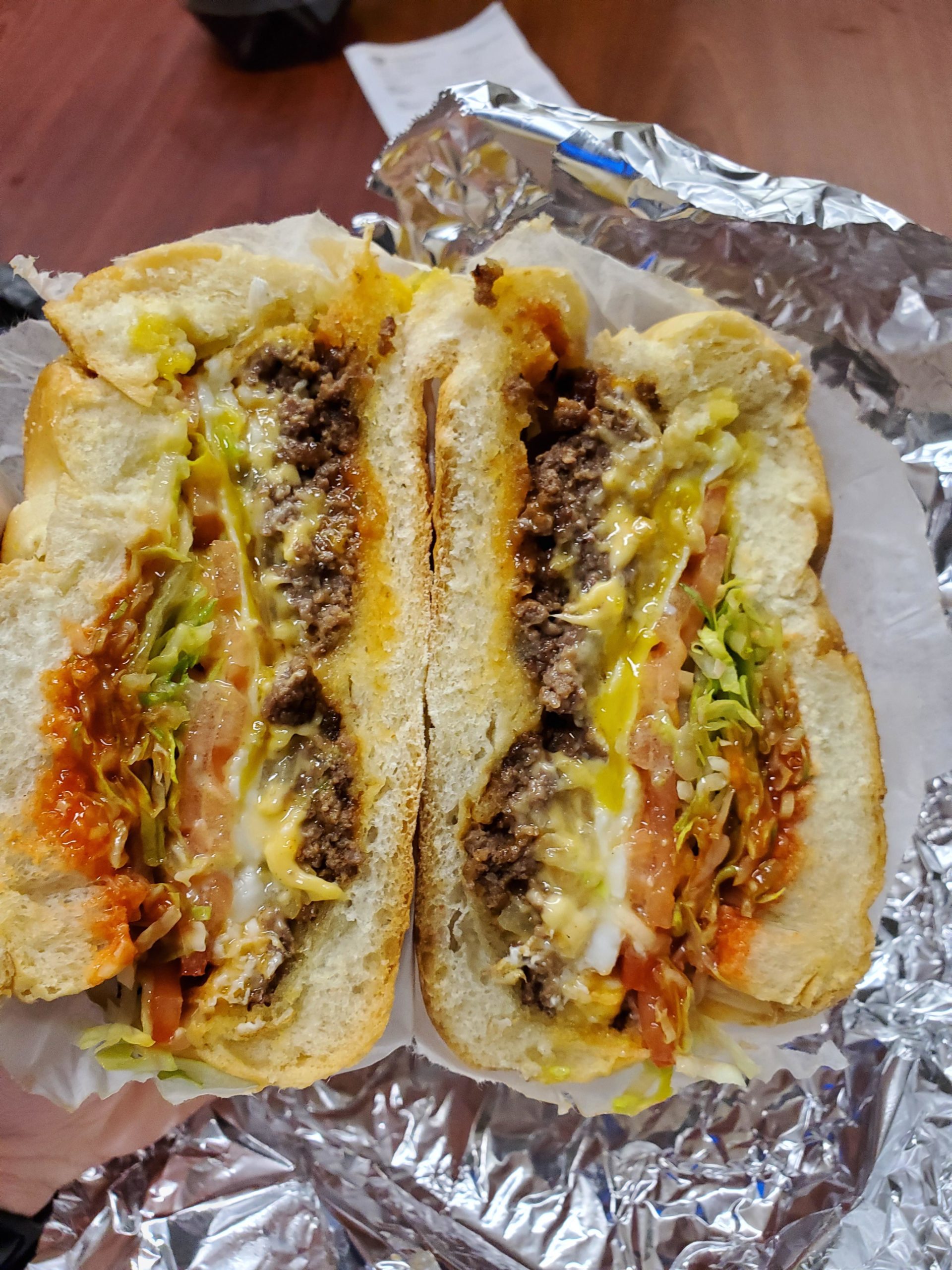 Chopped cheese sandwich with a Sunnyside up egg on top Dining and Cooking