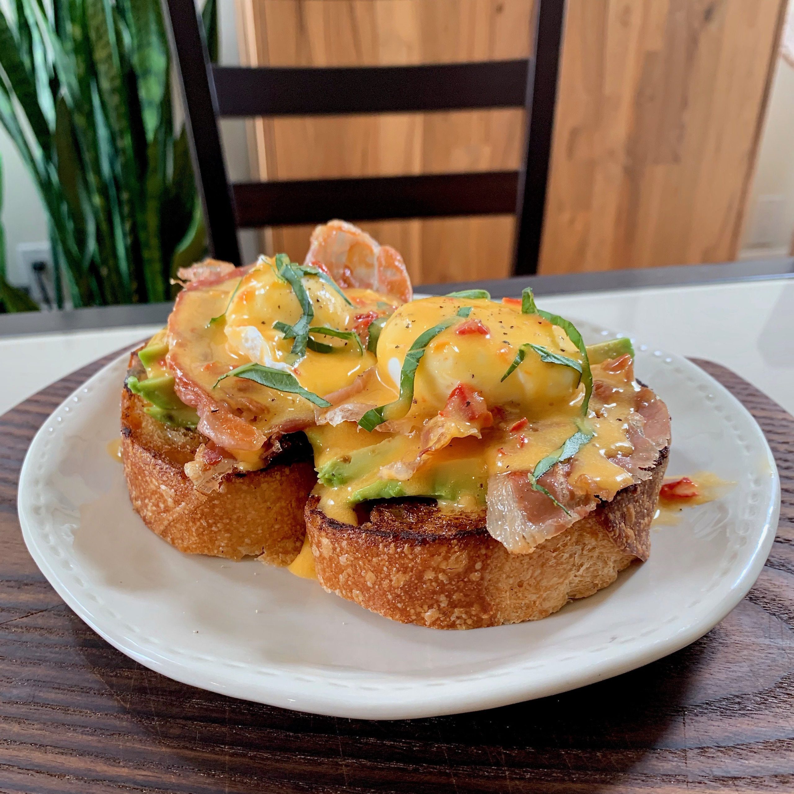 Eggs Benedict with Calabrian chili hollandaise, crispy prosciutto, and ...