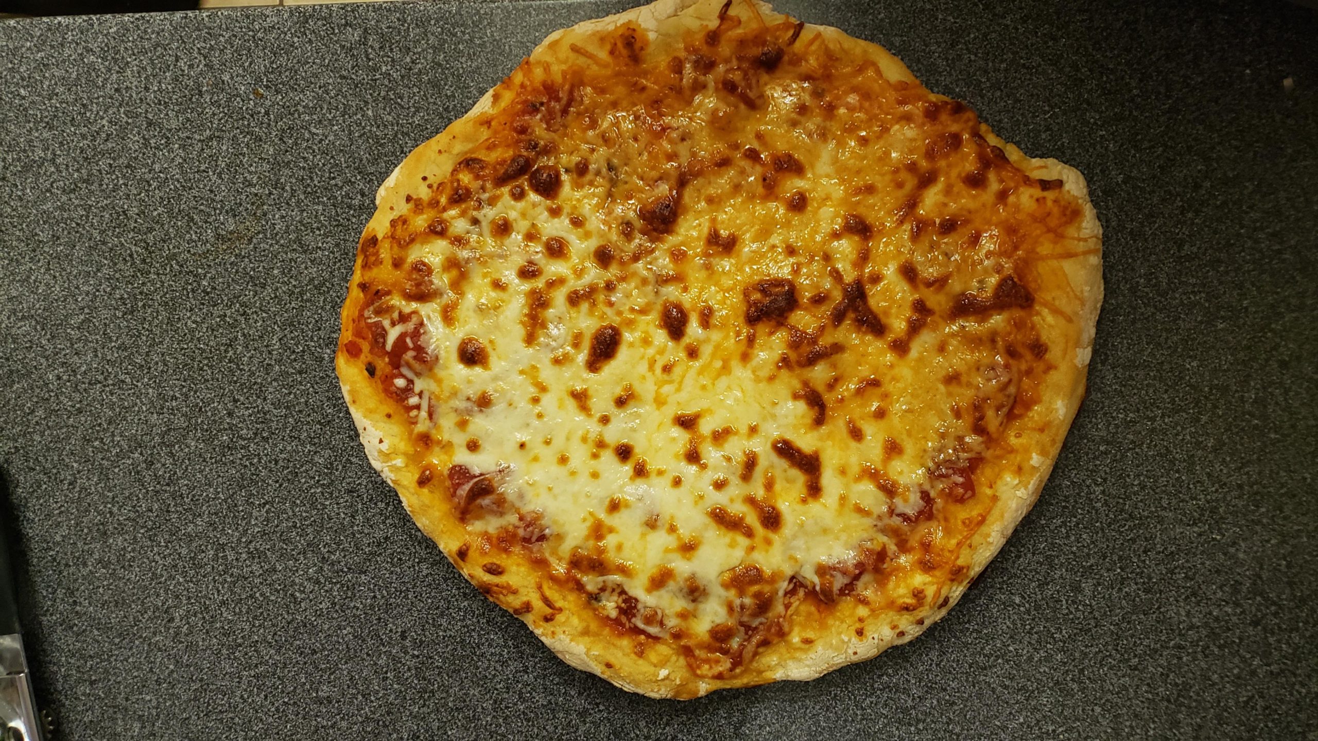 first-pizza-ever-it-s-almost-round-dining-and-cooking