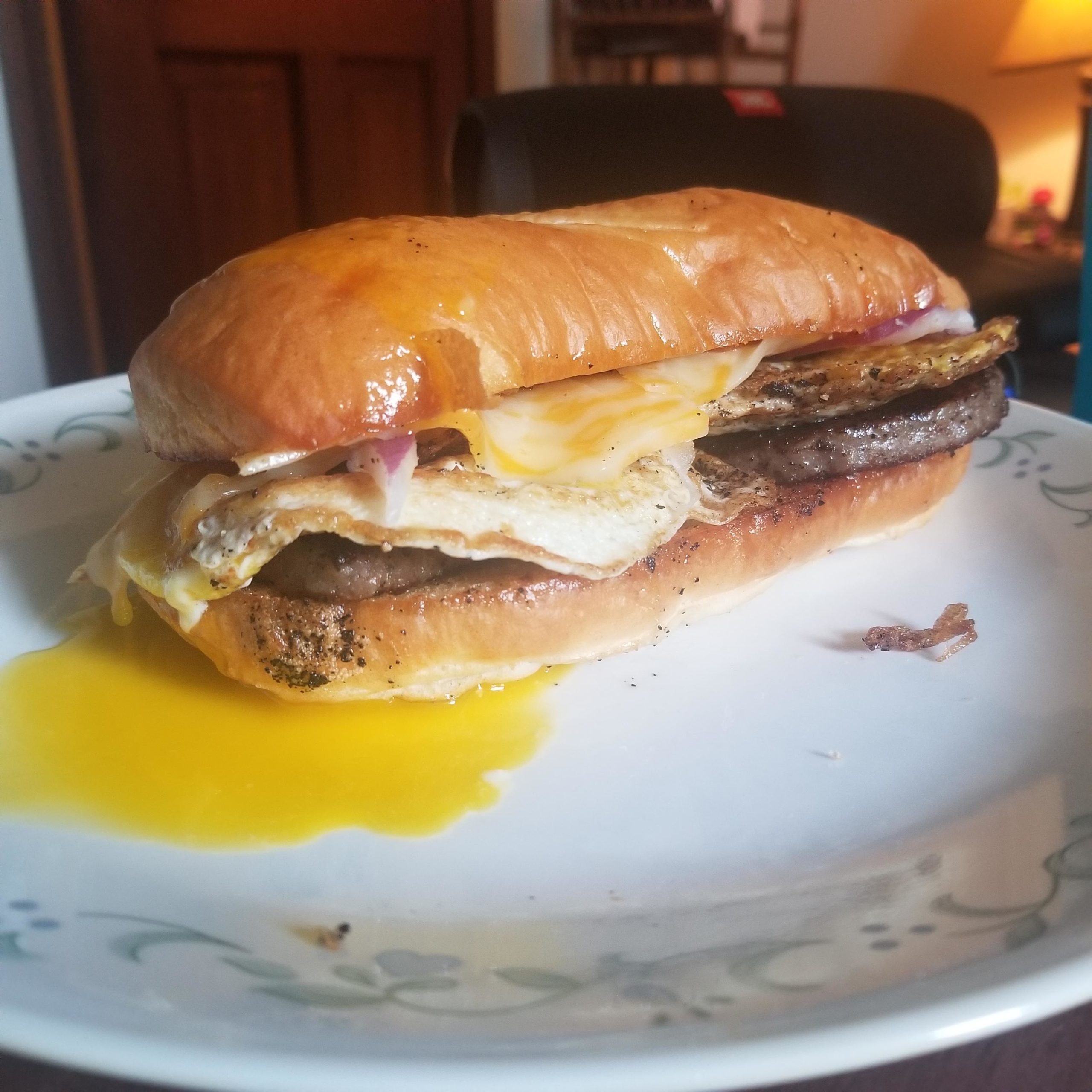 Quick breakfast sub. Toasted french roll, sausage, egg, red onion