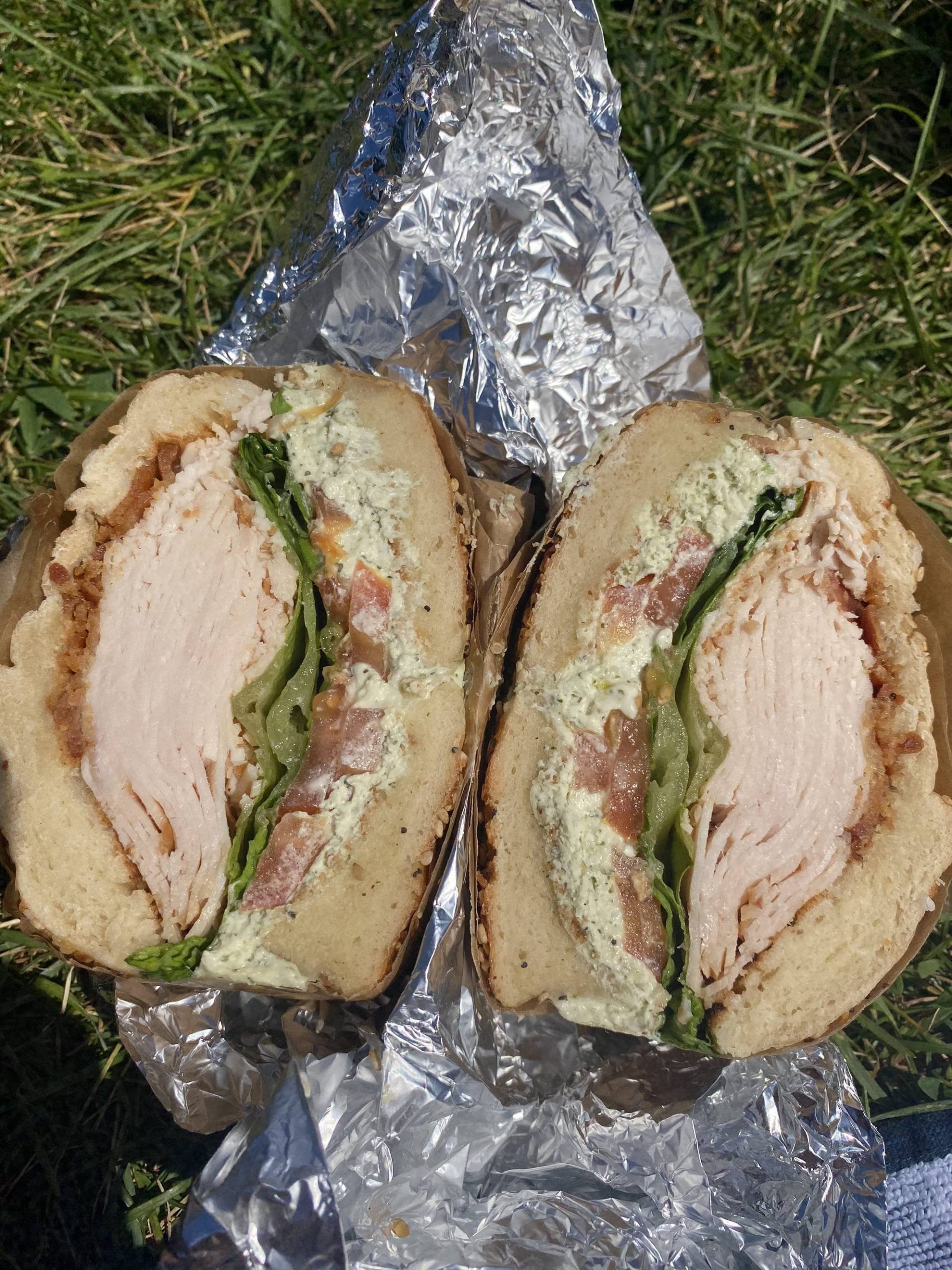 Turkey, bacon, lettuce, tomato, garlic and herb cream cheese on a ...