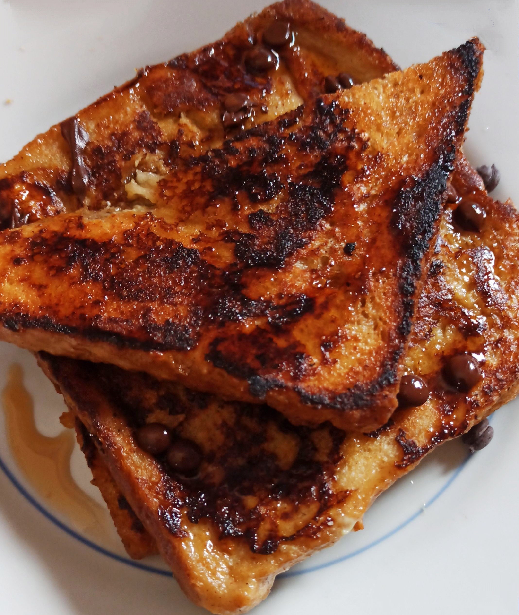 Some nice french toast i had, with chocolate chips and maple syrup ...