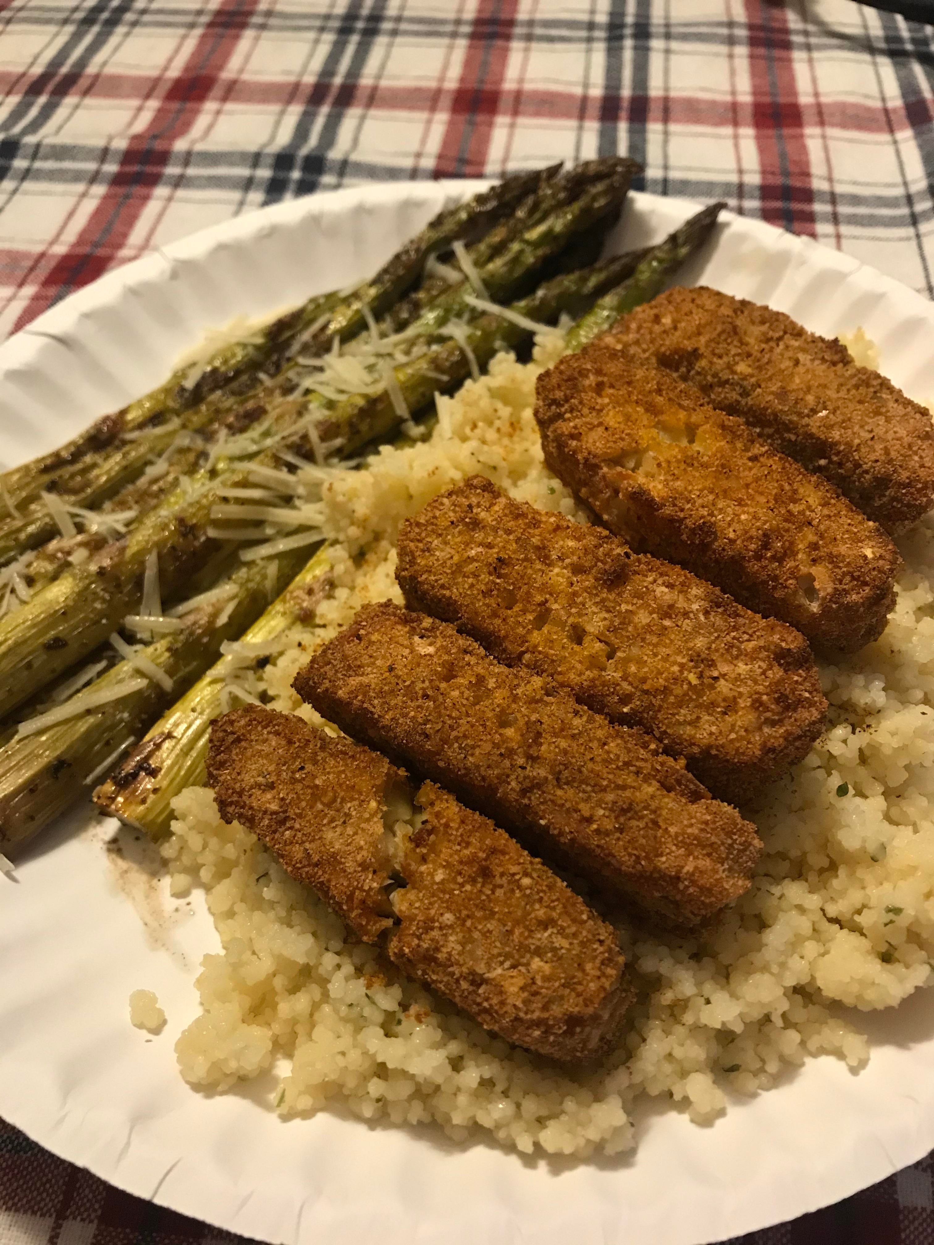 Crusted Tempeh Over Garlic Parmesan Couscous With A Side Of Roasted Asparagus Topped With Lemon And A Teensy Bit Of Parmesan To Finish Dining And Cooking