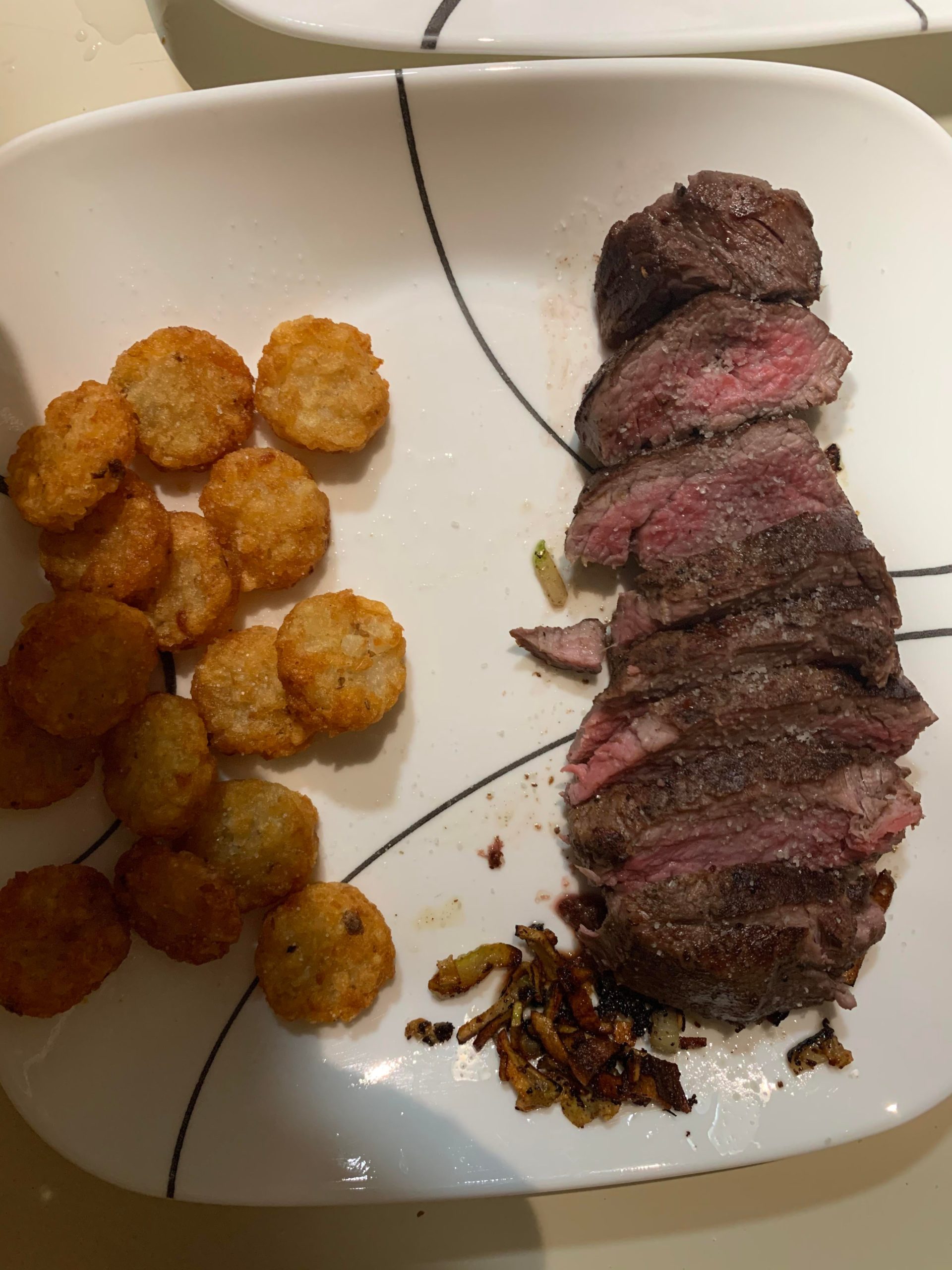 133 filet 2 hours seared cast iron with elephant garlic and tots ...