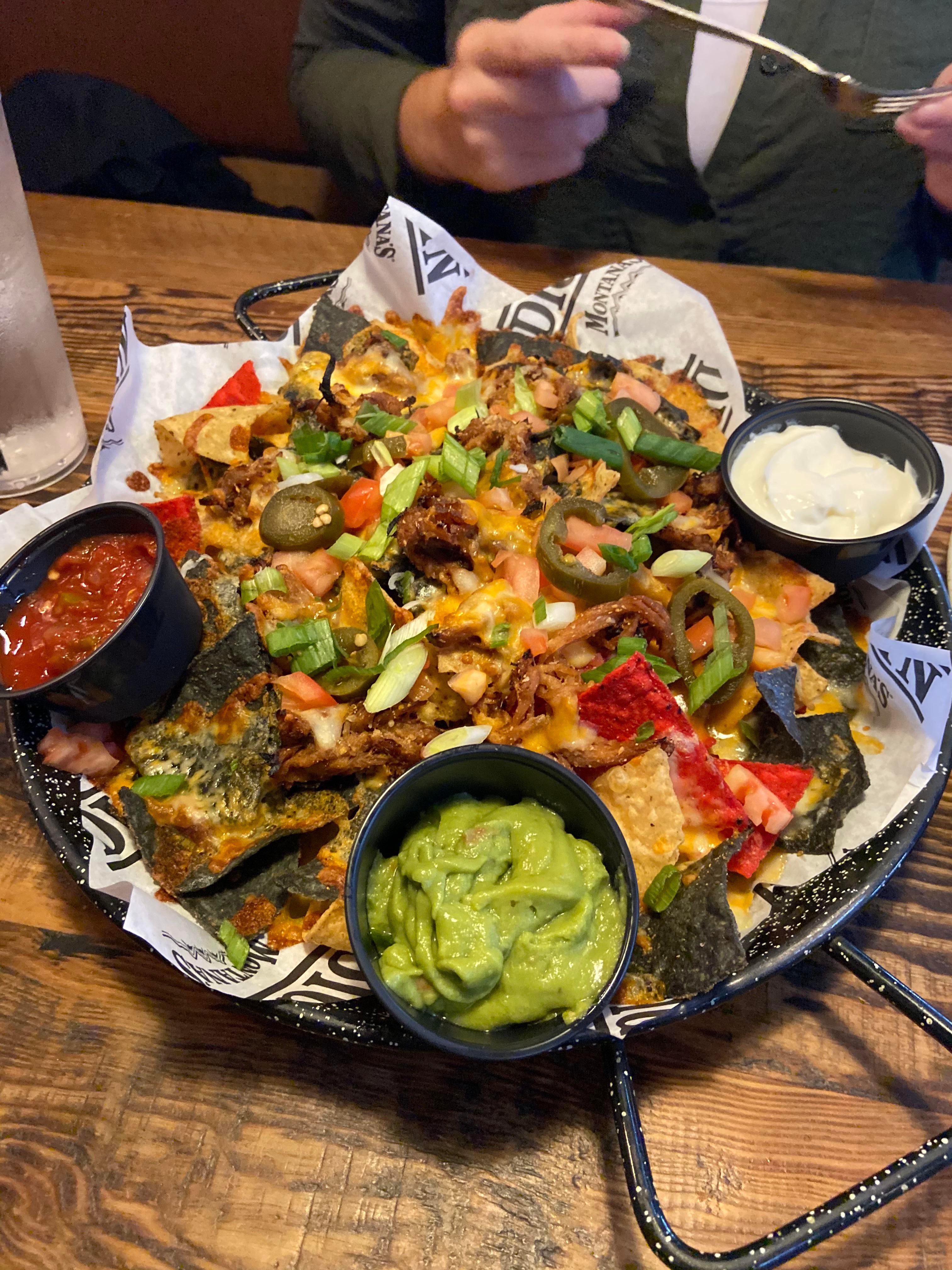 Fully loaded pulled pork nachos with guac and extra cheese! Taste ...