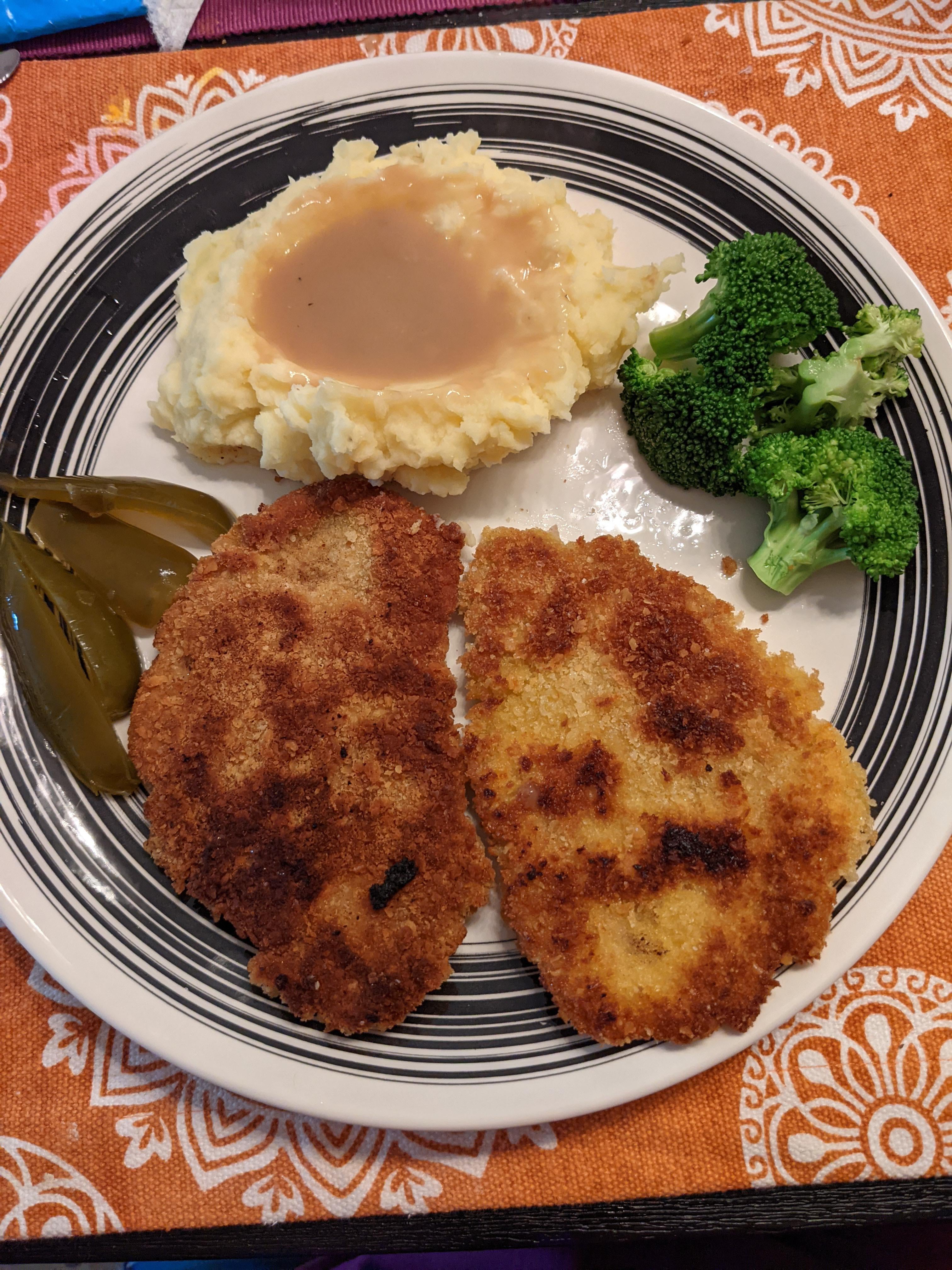 Breaded pork tenderloin, mashed potatoes, gravy and steamed broccoli ...