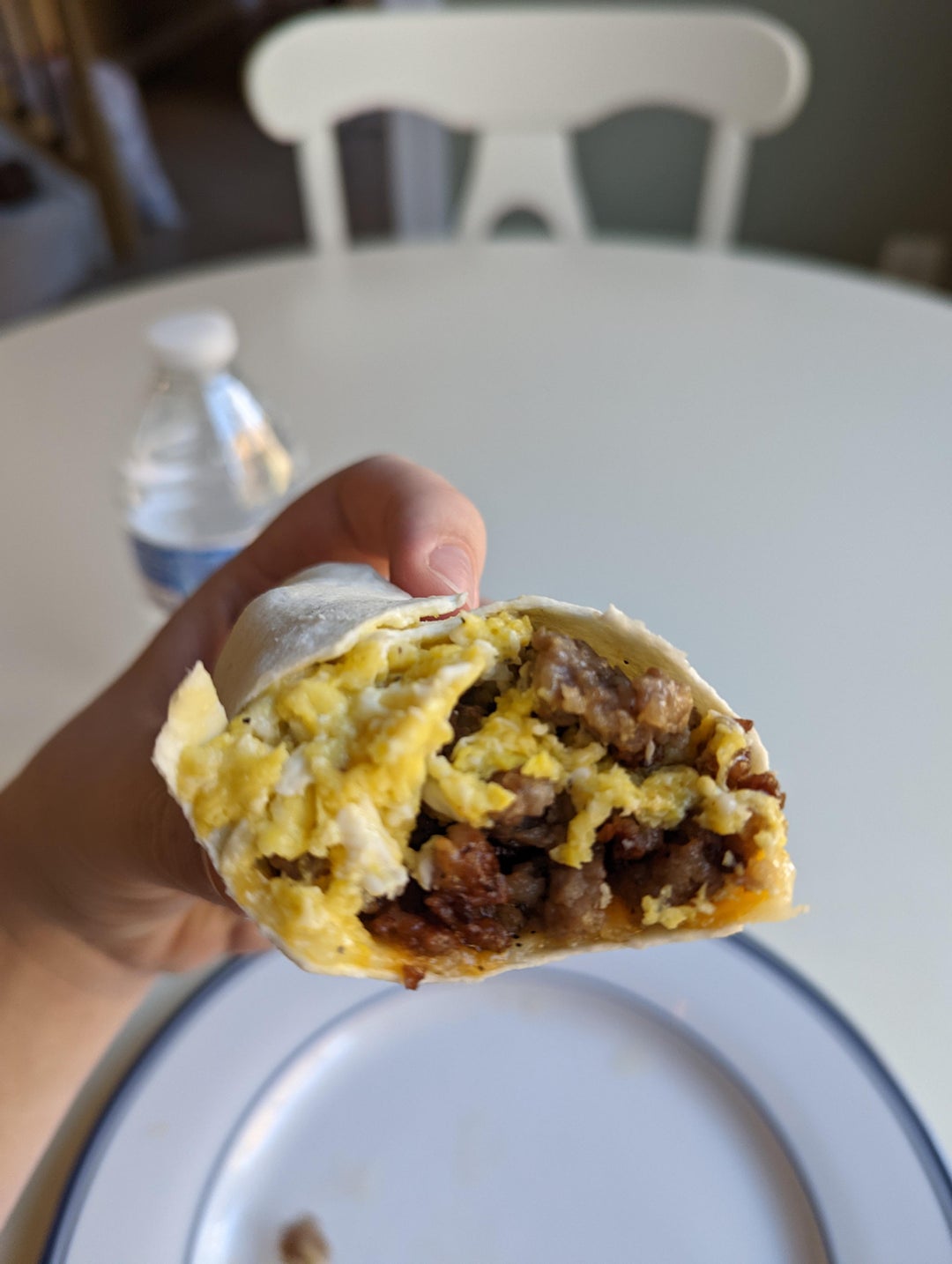 500 calorie breakfast wrap. scrambled eggs, sausage patty and cheese on