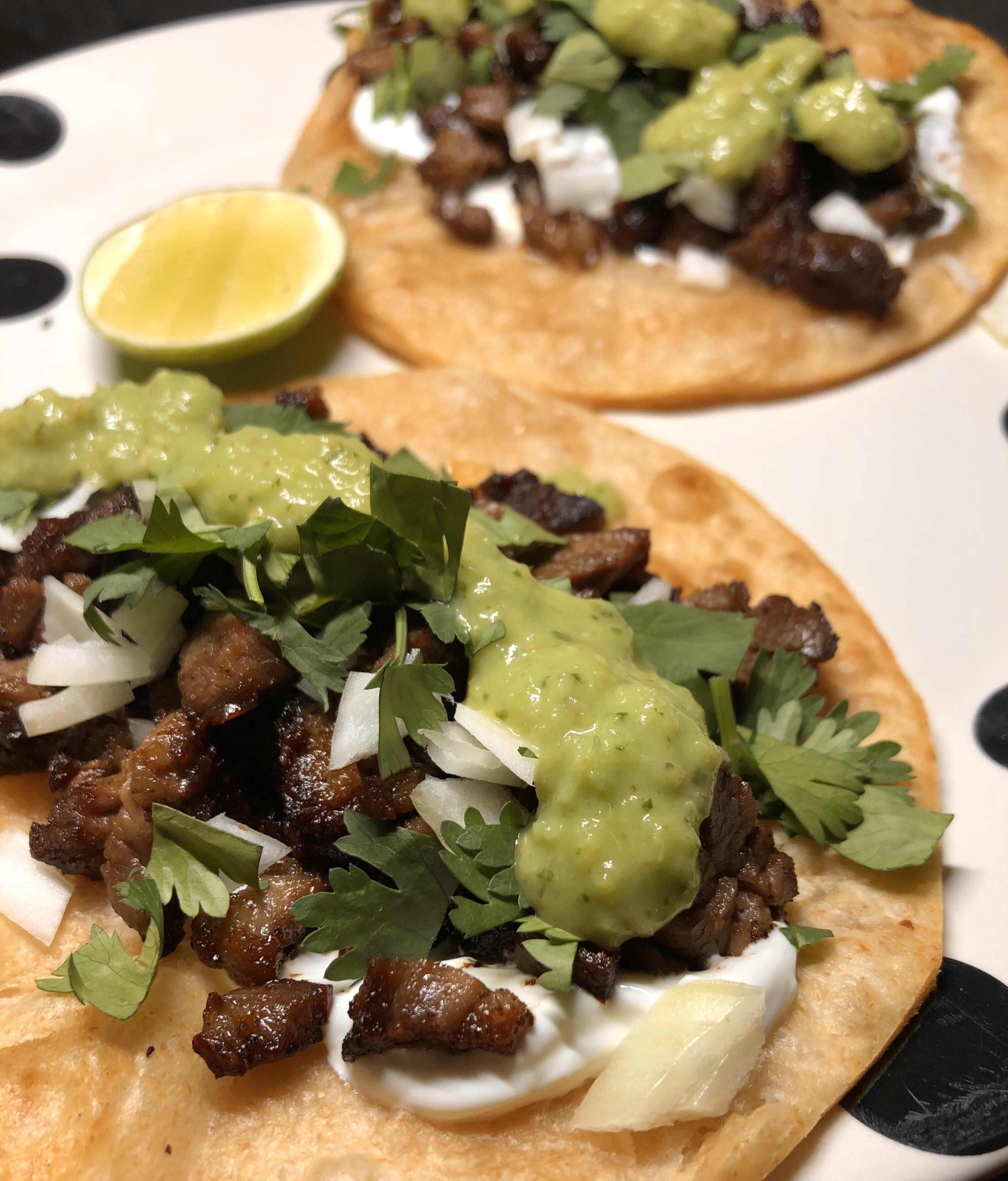 Skirt steak tacos, salsa verde (homemade), crème, organic tortilla