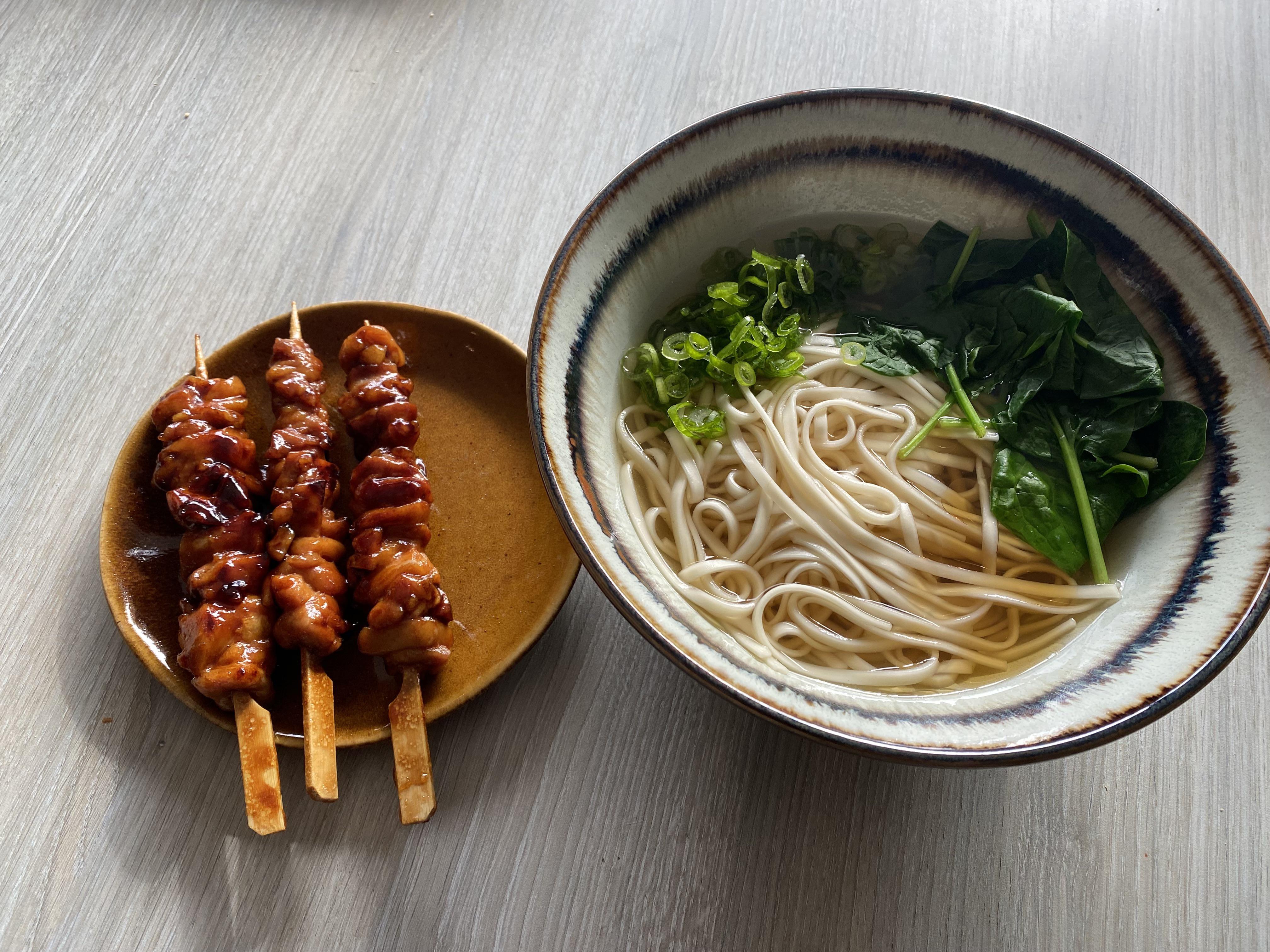 Simple dashi with spinach green onion and chicken teriyaki skewers