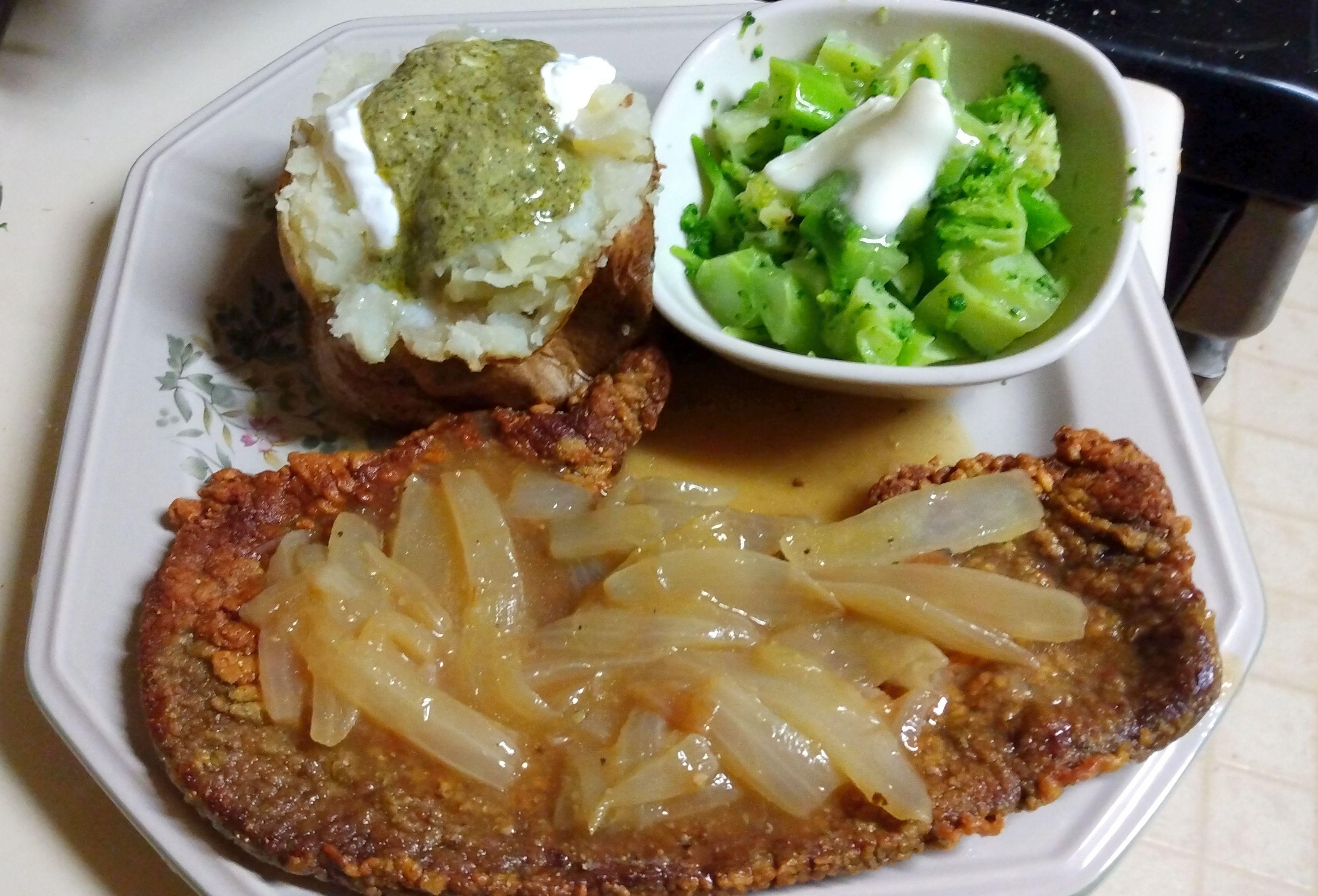 Flash fried calves liver, Sauteed onion gravy, baked potato, and some