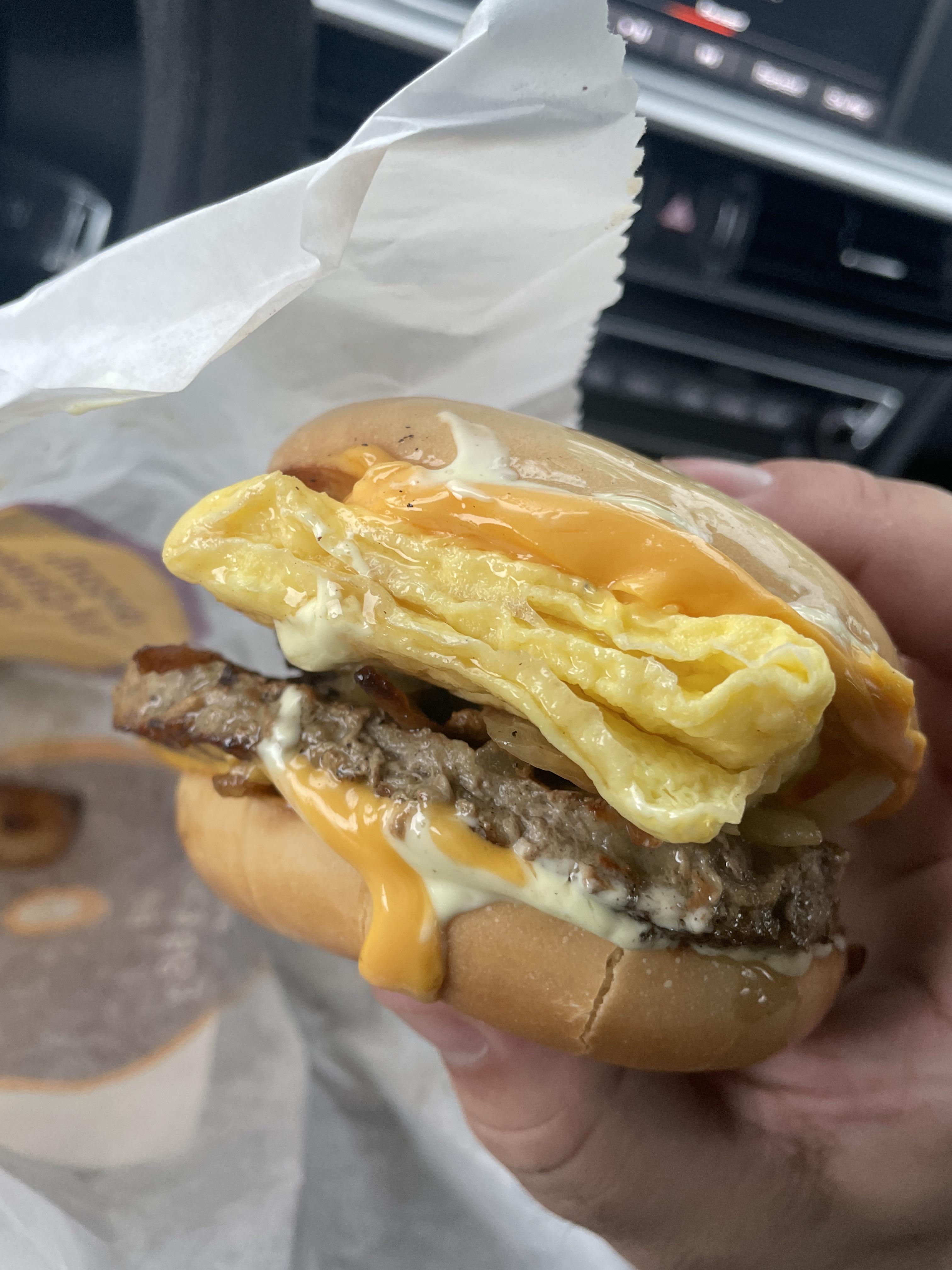 Steak, egg, and cheese breakfast bagel with extra grilled onions and