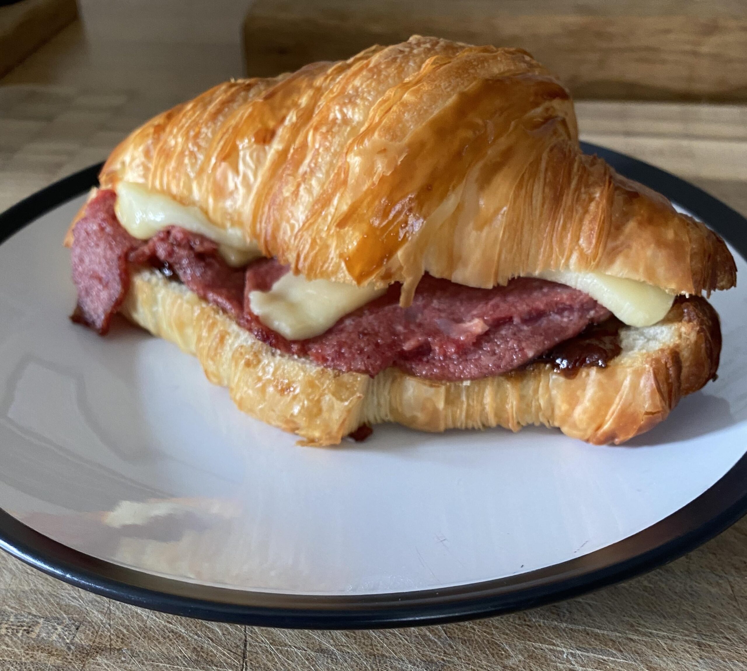 [I ate] cheddar, manchego, corned beef and branston pickle croissant ...