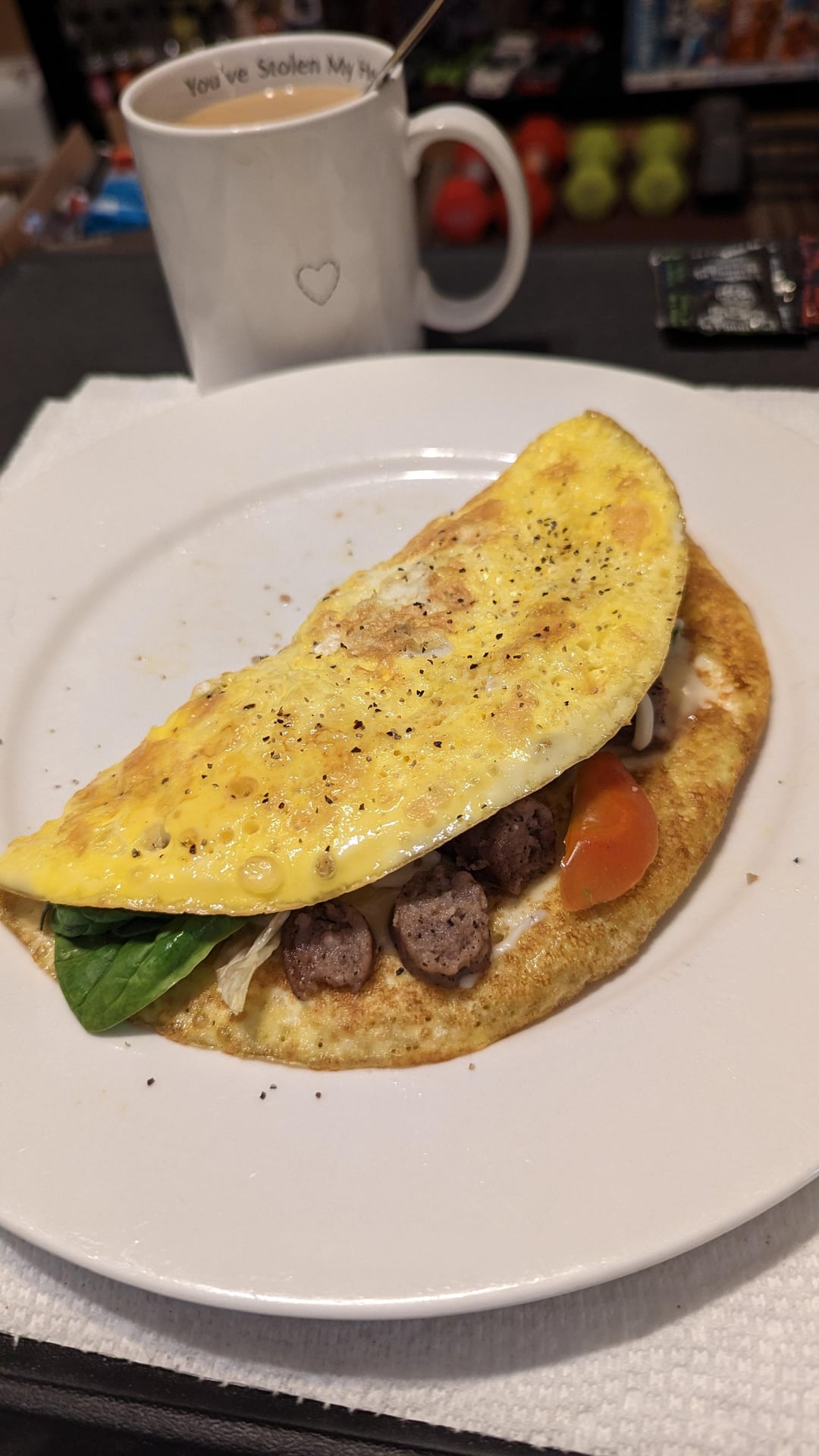 Homemade omelette with sausage, peppers, tomato cheese, and spinach ...