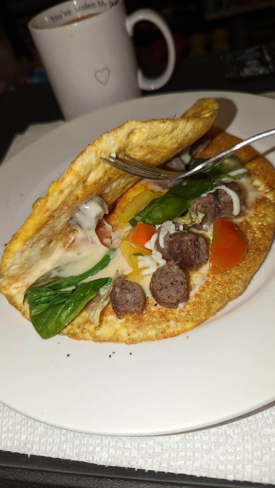 Homemade omelette with sausage, peppers, tomato cheese, and spinach ...